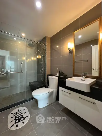 Modern bathroom with glass shower and elegant fixtures