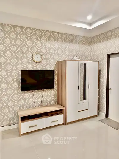 Modern living room with stylish wallpaper and sleek furniture