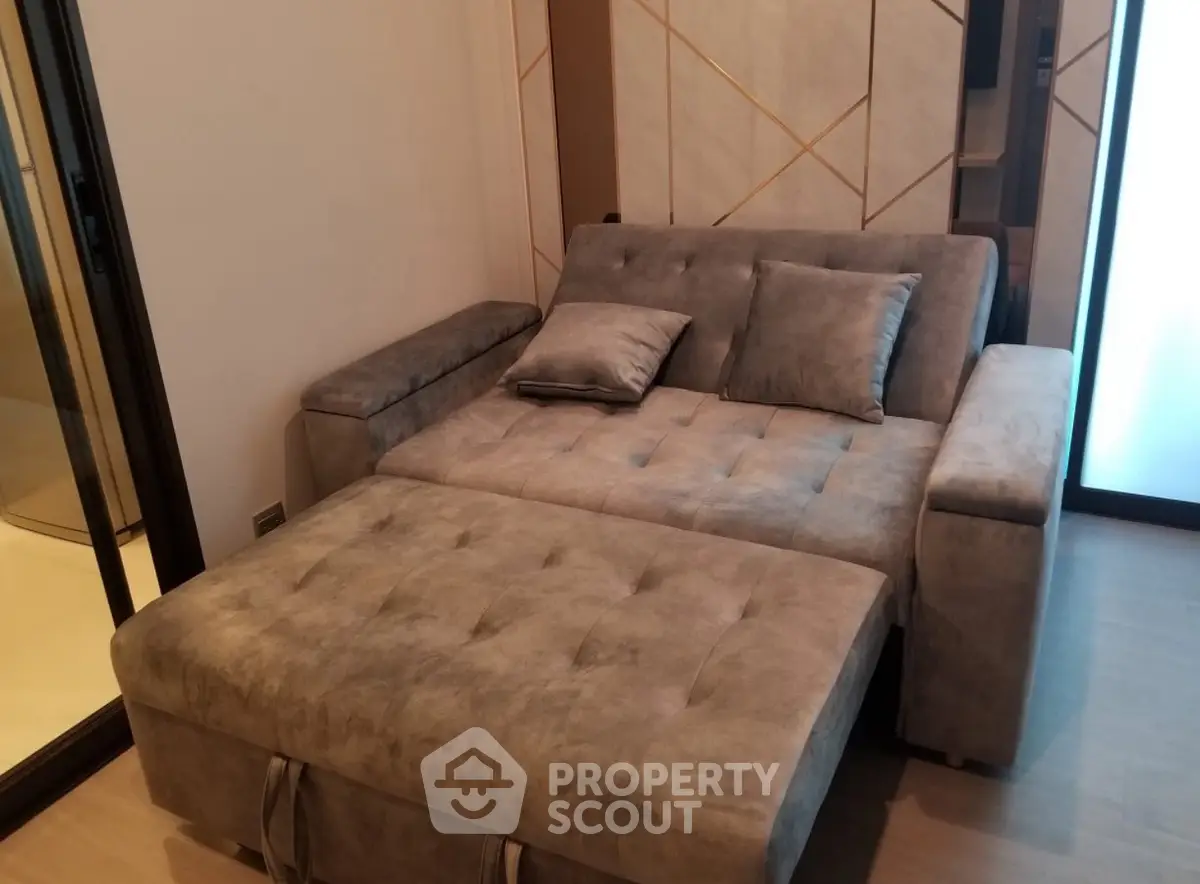 Luxurious modern living room with plush gray sofa and elegant decor