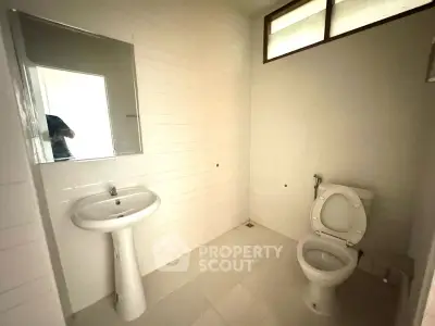 Spacious bathroom with modern fixtures and natural light