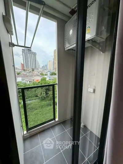 Charming balcony with city view, perfect for relaxation and enjoying the skyline.