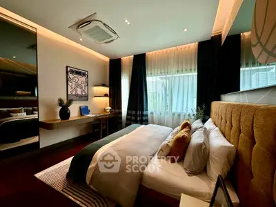 Luxurious bedroom with modern decor, plush bedding, and ambient lighting, perfect for relaxation and comfort.