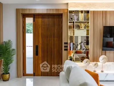 Luxurious living room with elegant wooden door and stylish decor