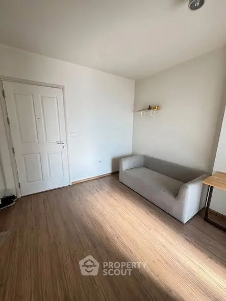 Minimalist living room with wooden flooring and modern sofa