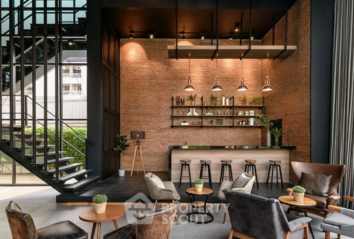 Stylish modern lobby with industrial design and cozy seating area