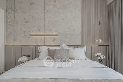 Luxurious modern bedroom with elegant decor and plush bedding