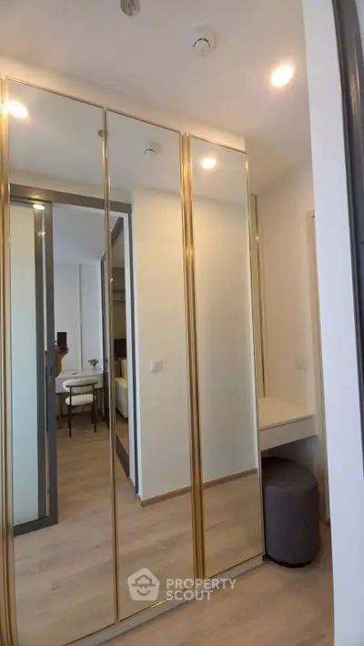 Modern bedroom with mirrored closet doors and sleek design
