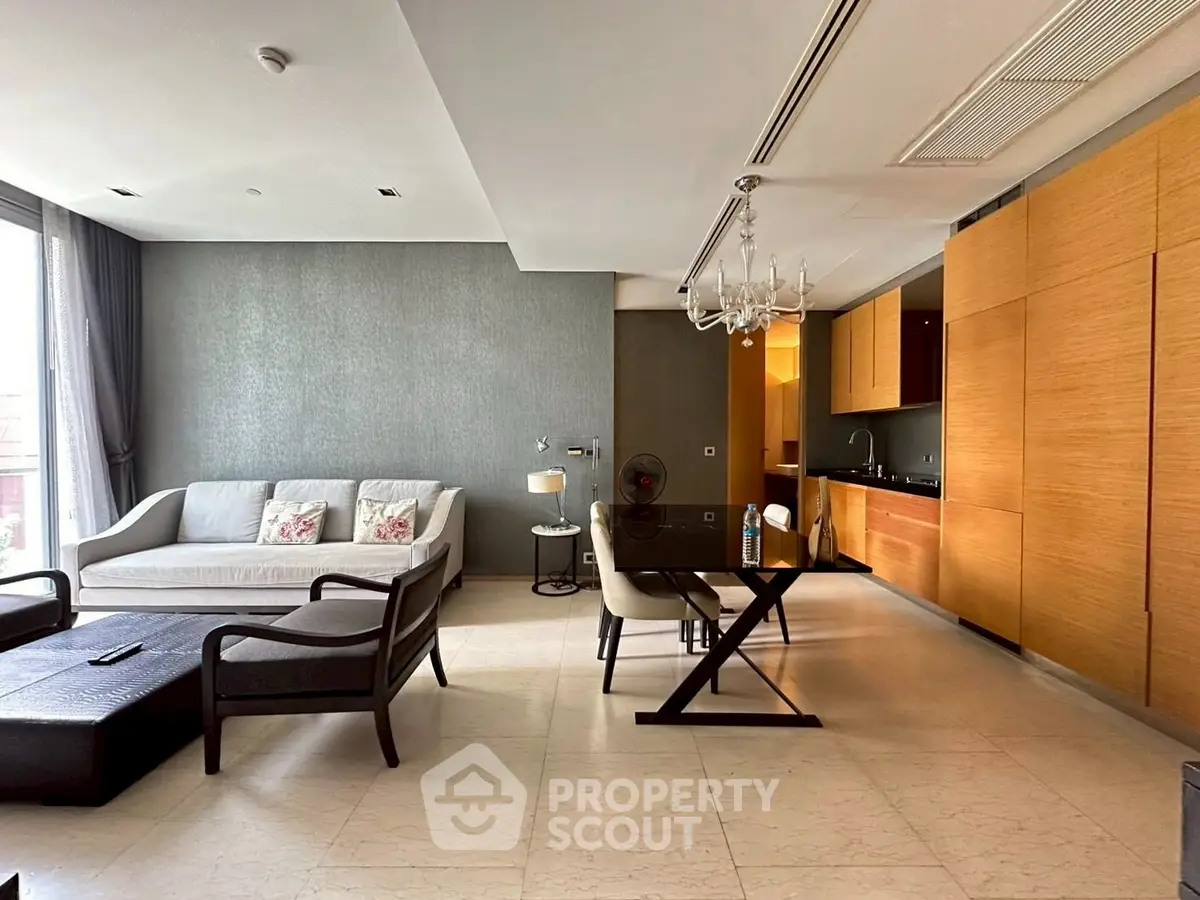 Modern open-plan living room with sleek kitchen and elegant dining area