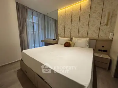 Elegant bedroom with modern decor and large window, featuring a cozy bed and stylish lighting.