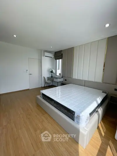 Spacious modern bedroom with elegant design and natural light