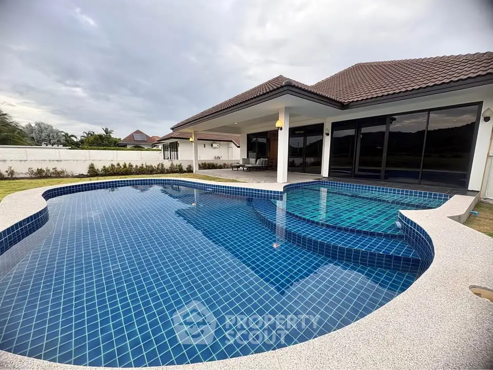 Luxurious villa with stunning private pool and spacious outdoor area, perfect for relaxation and entertainment.