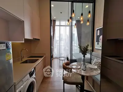 Modern apartment with open kitchen and cozy dining area, featuring stylish lighting and city view.