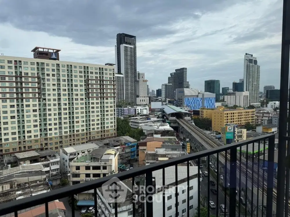 Stunning cityscape view from a high-rise balcony overlooking urban skyline.