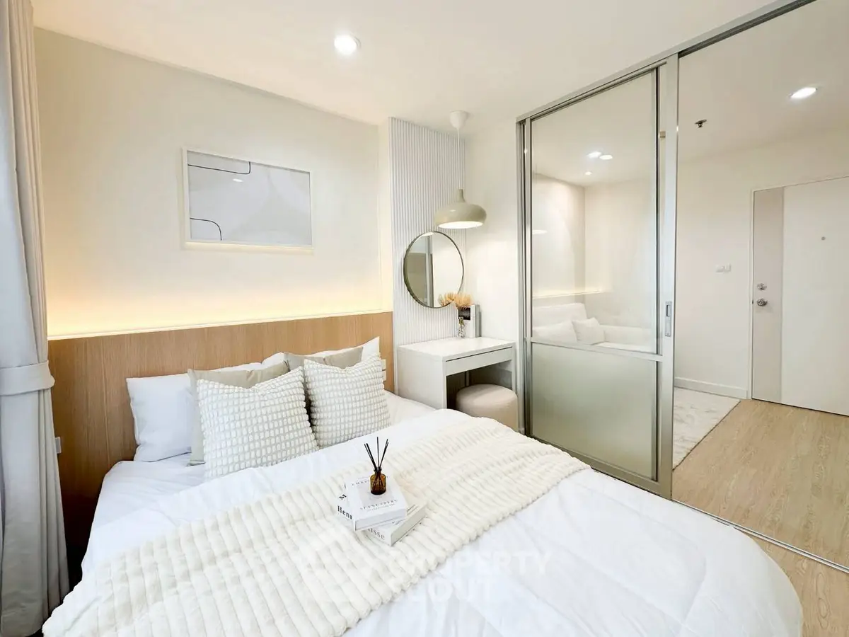 Modern bedroom with cozy decor and mirrored closet doors