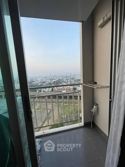 Stunning city view from a modern apartment balcony, perfect for relaxation and enjoying the skyline.