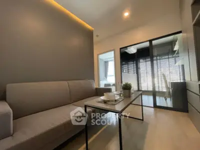 Modern living room with sleek furniture and natural light, perfect for urban living.