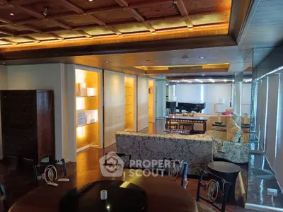 Luxurious living room with elegant decor and spacious seating area, featuring a grand piano and stylish lighting.
