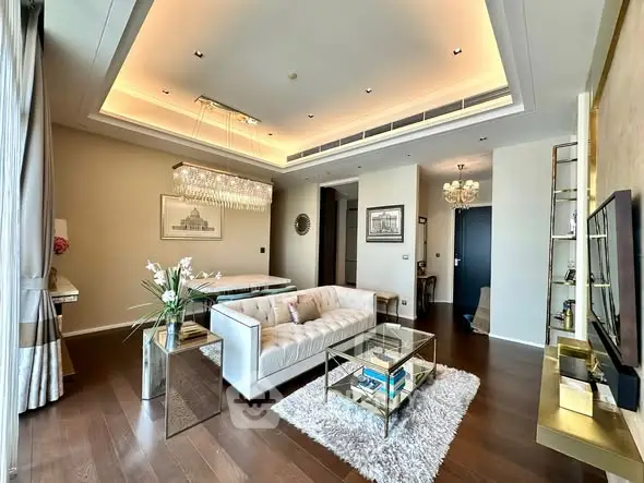Luxurious living room with elegant decor and modern lighting in upscale apartment.