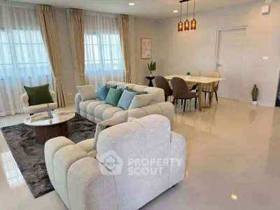 Spacious modern living room with elegant decor and dining area