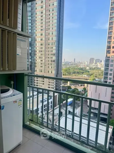 High-rise balcony with cityscape view and washing machine, perfect for urban living.