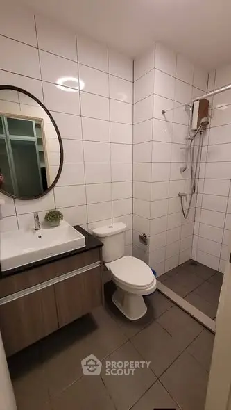 Modern bathroom with sleek tiles and stylish fixtures in a contemporary home.