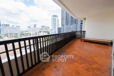 Spacious balcony with stunning city view and terracotta tiles