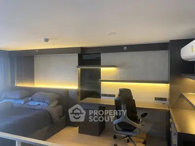 Modern bedroom with integrated study area and sleek lighting