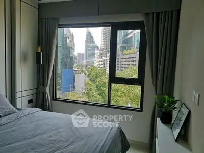 Modern bedroom with city view and stylish decor