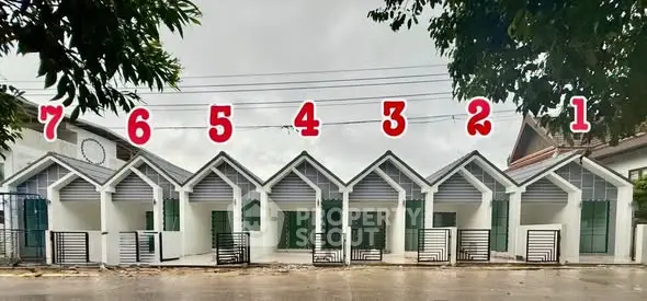 Row of modern townhouses with numbered units, ideal for urban living.