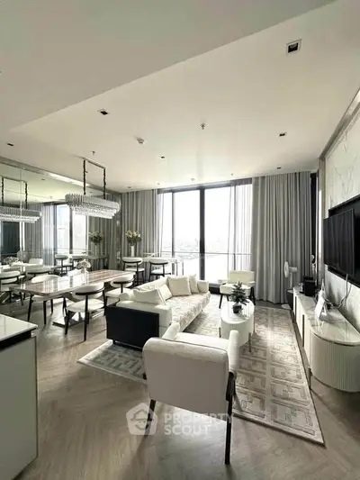 Luxurious modern living room with elegant decor and large windows offering stunning views.