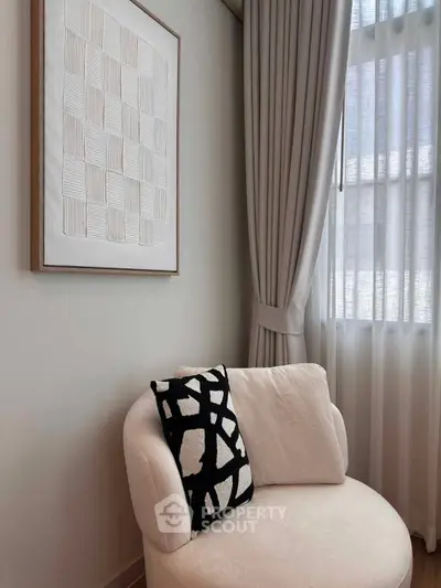 Elegant living room corner with stylish chair and modern art