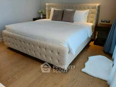Luxurious bedroom with plush bed and elegant decor, perfect for relaxation.