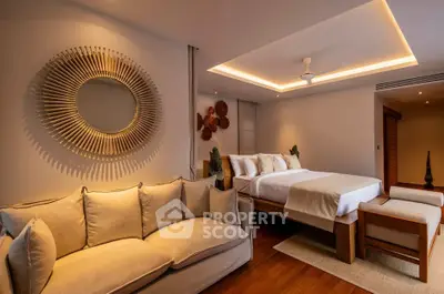 Luxurious bedroom with elegant decor and cozy seating area