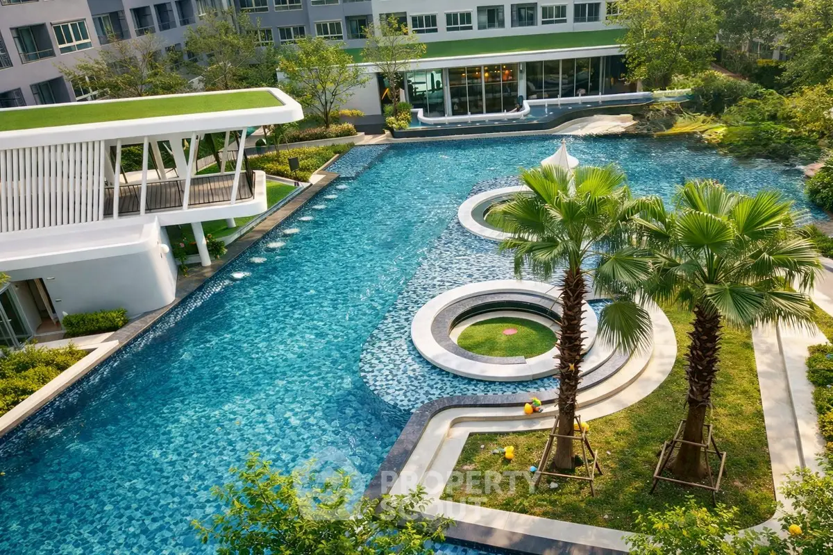 Luxurious residential complex with stunning pool and lush greenery, perfect for relaxation and leisure.