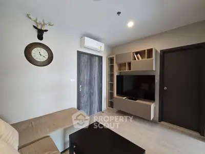 Modern living room with stylish decor and wall-mounted TV