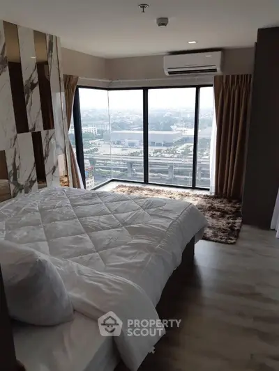 Luxurious bedroom with panoramic city view and modern decor