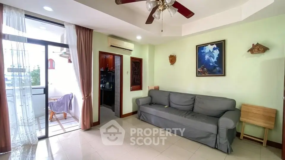 Spacious living room with balcony access and modern decor