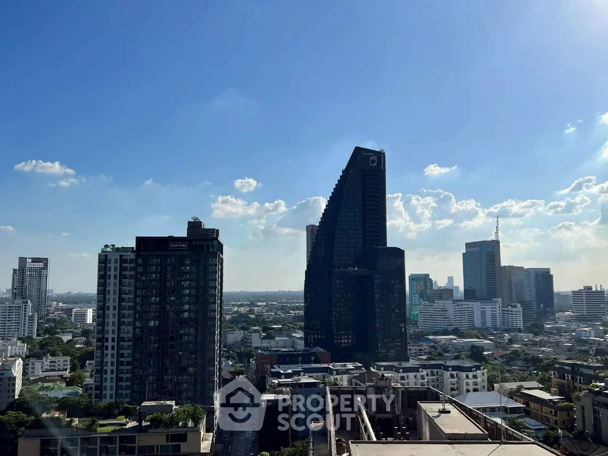 Stunning cityscape view with modern skyscrapers under a clear blue sky, perfect for urban living enthusiasts.
