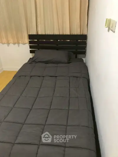 Cozy bedroom with single bed and minimalist decor