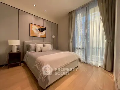 Elegant bedroom with modern decor and large window in upscale apartment