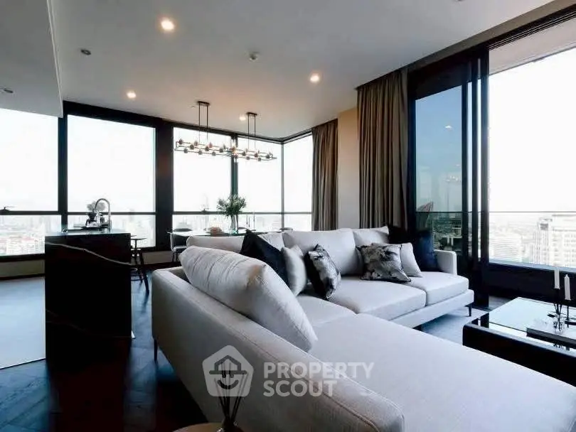Luxurious modern living room with panoramic city views and elegant furnishings.