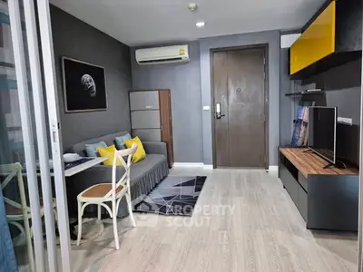 Modern living room with stylish decor and air conditioning in a cozy apartment.