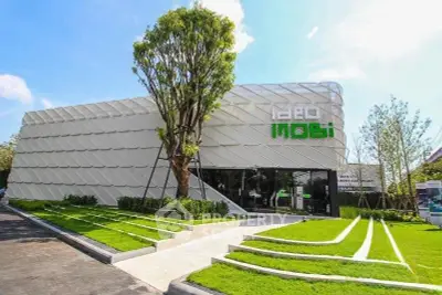 Modern architectural building with unique facade and landscaped garden