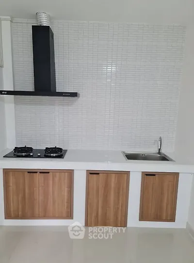 Modern kitchen with gas stove and sleek cabinetry