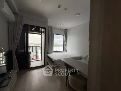 Modern bedroom with balcony view in stylish apartment
