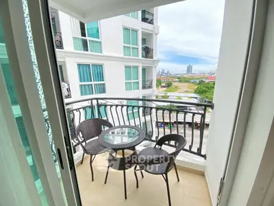 Charming balcony with city view, perfect for relaxation and enjoying the outdoors.