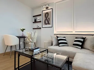 Stylish modern living room with elegant decor and cozy seating area.