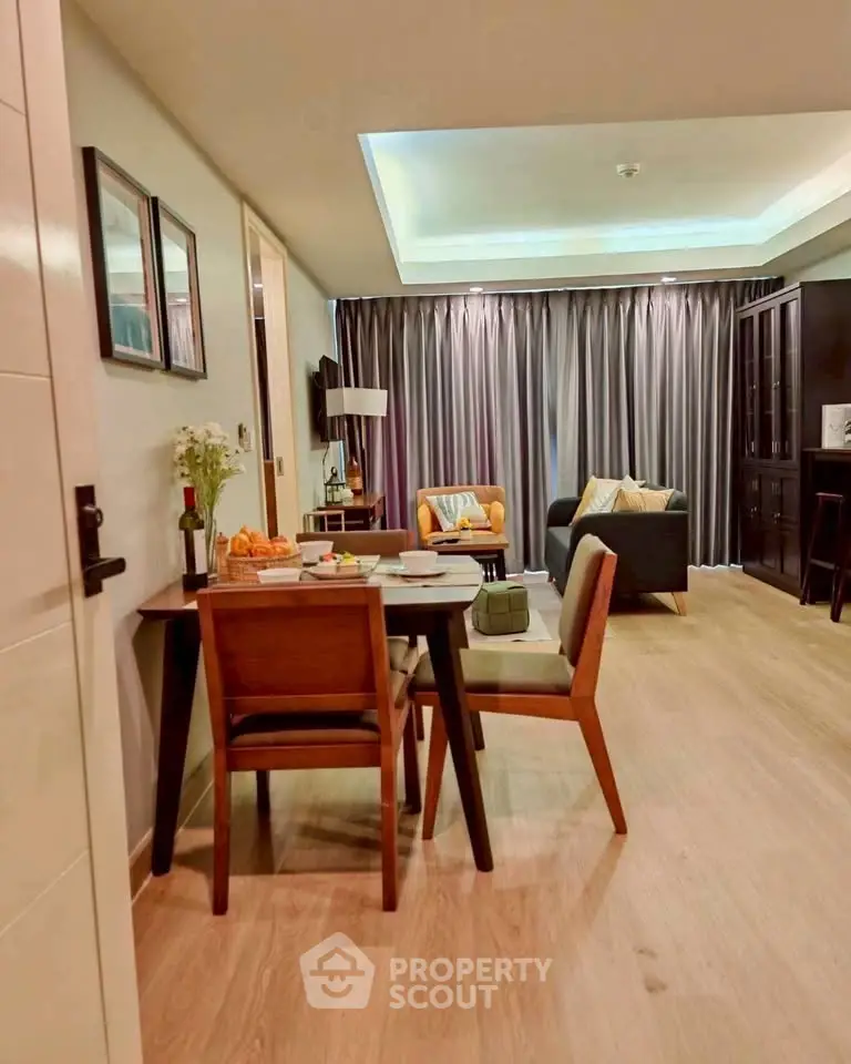 Modern living room with dining area, stylish furniture, and cozy ambiance