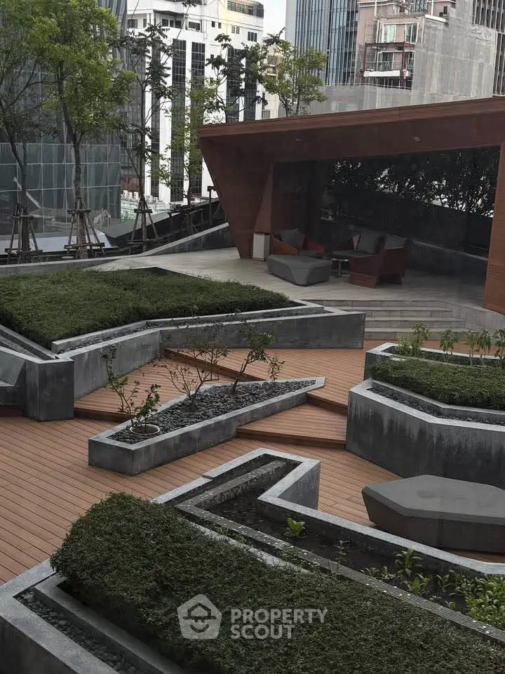 Modern urban rooftop garden with stylish seating area and lush greenery