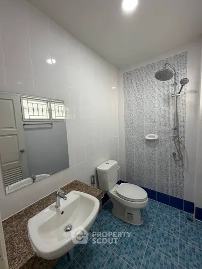 Modern bathroom with sleek fixtures and stylish tile design